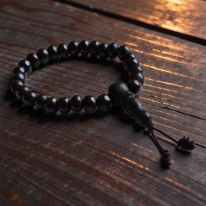 Bracelet bouddhiste en perles noires sur bois, pour méditation et philosophie tibétaine