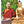 Lama Samten en robe rouge avec statue dorée de Bouddha, livre 'Le bonheur au jour le jour'